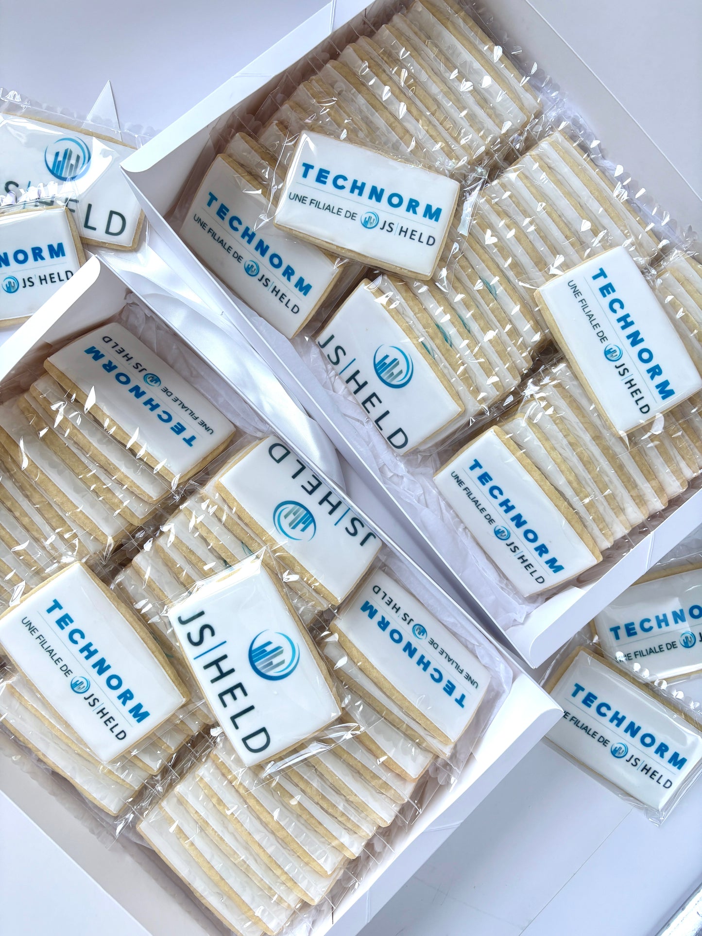 Rectangle cookies with the Technorm company logo in icing