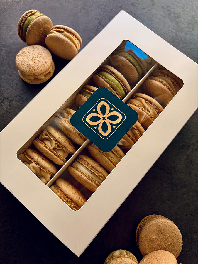 Box of macarons with the Cookie Canvas logo