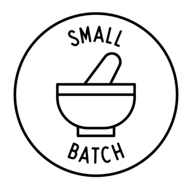 Logo with a mortar and pestle and 'Small Batch' text inside a circle on a white background